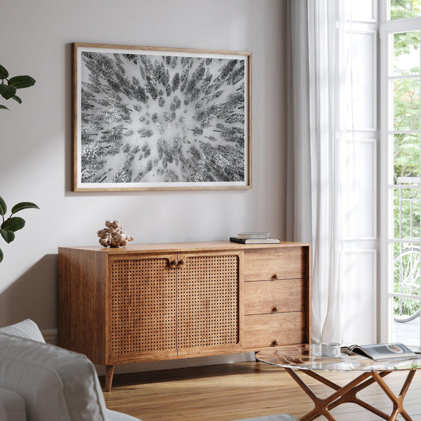 Snowy forest wall art with aerial photography of snow-covered trees in winter.