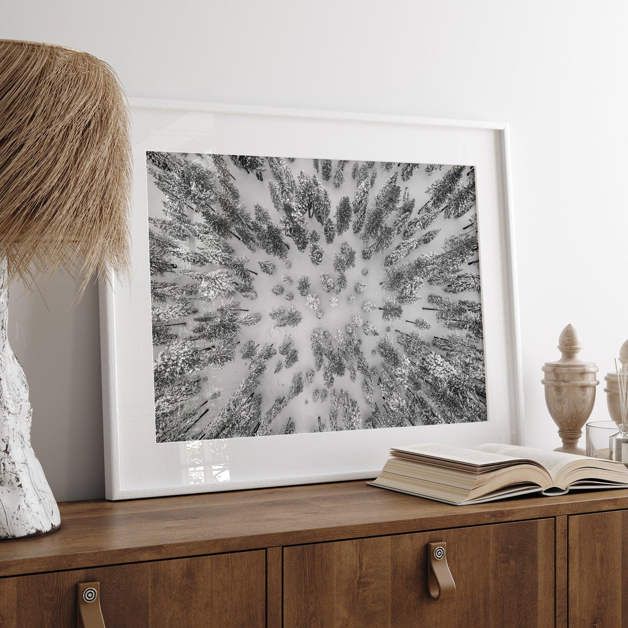 Snowy forest wall art with aerial photography of snow-covered trees in winter.