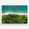 A fine art beach print from above with emerald colors and lush forest.