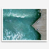Aerial photo of Pismo Pier with surfers and turquoise ocean waves, ideal for coastal wall decor.