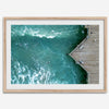 Aerial photo of Pismo Pier with surfers and turquoise ocean waves, ideal for coastal wall decor.