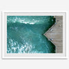 Aerial photo of Pismo Pier with surfers and turquoise ocean waves, ideal for coastal wall decor.