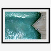 Aerial photo of Pismo Pier with surfers and turquoise ocean waves, ideal for coastal wall decor.