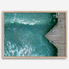 Aerial photo of Pismo Pier with surfers and turquoise ocean waves, ideal for coastal wall decor.