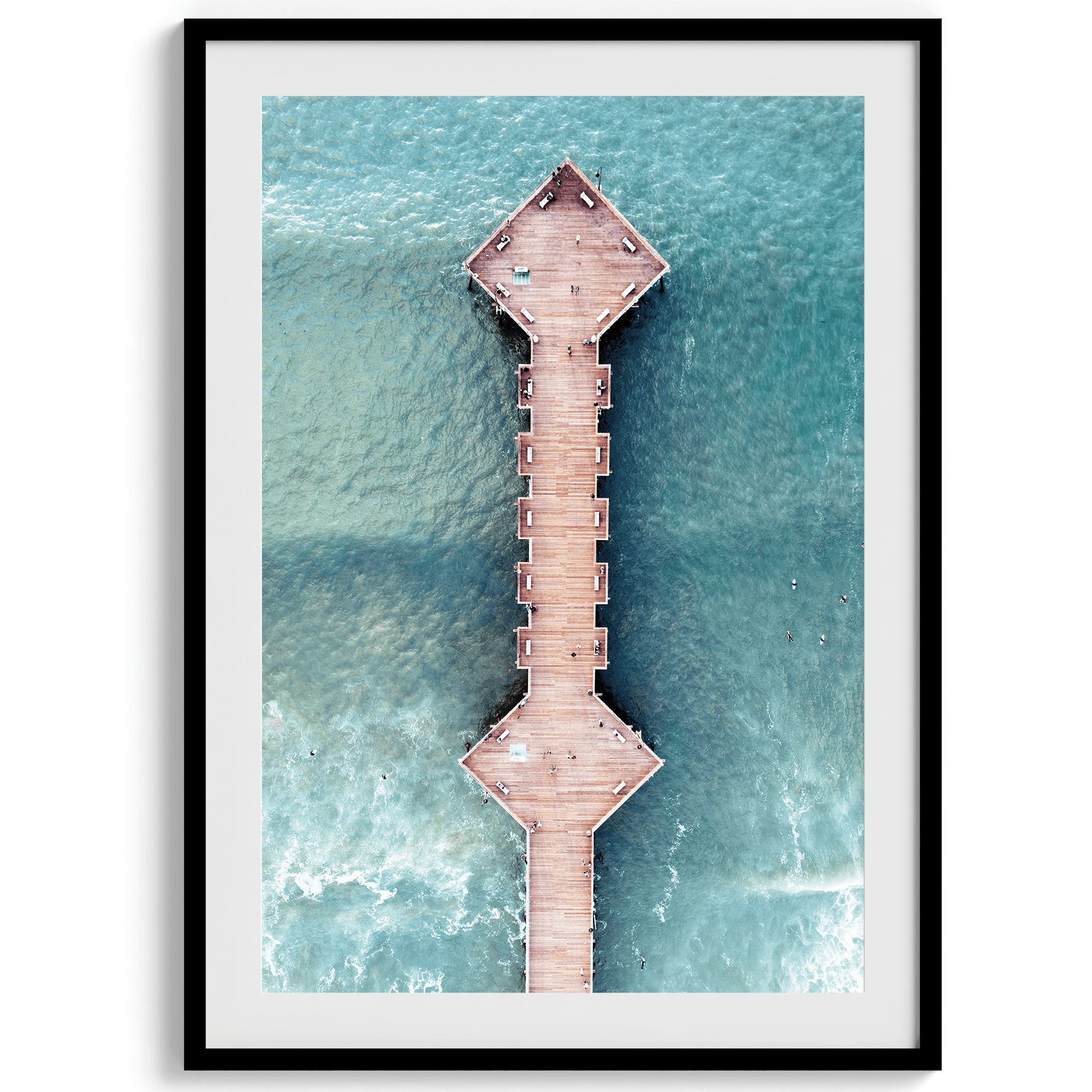 A fine art aerial beach pier photography pier. This ocean drone photography print was taken in Pismo Beach, California 300 feet above the ground. The result is minimalist geometrical wall art that brings out the beauty of the Pacific Ocean.