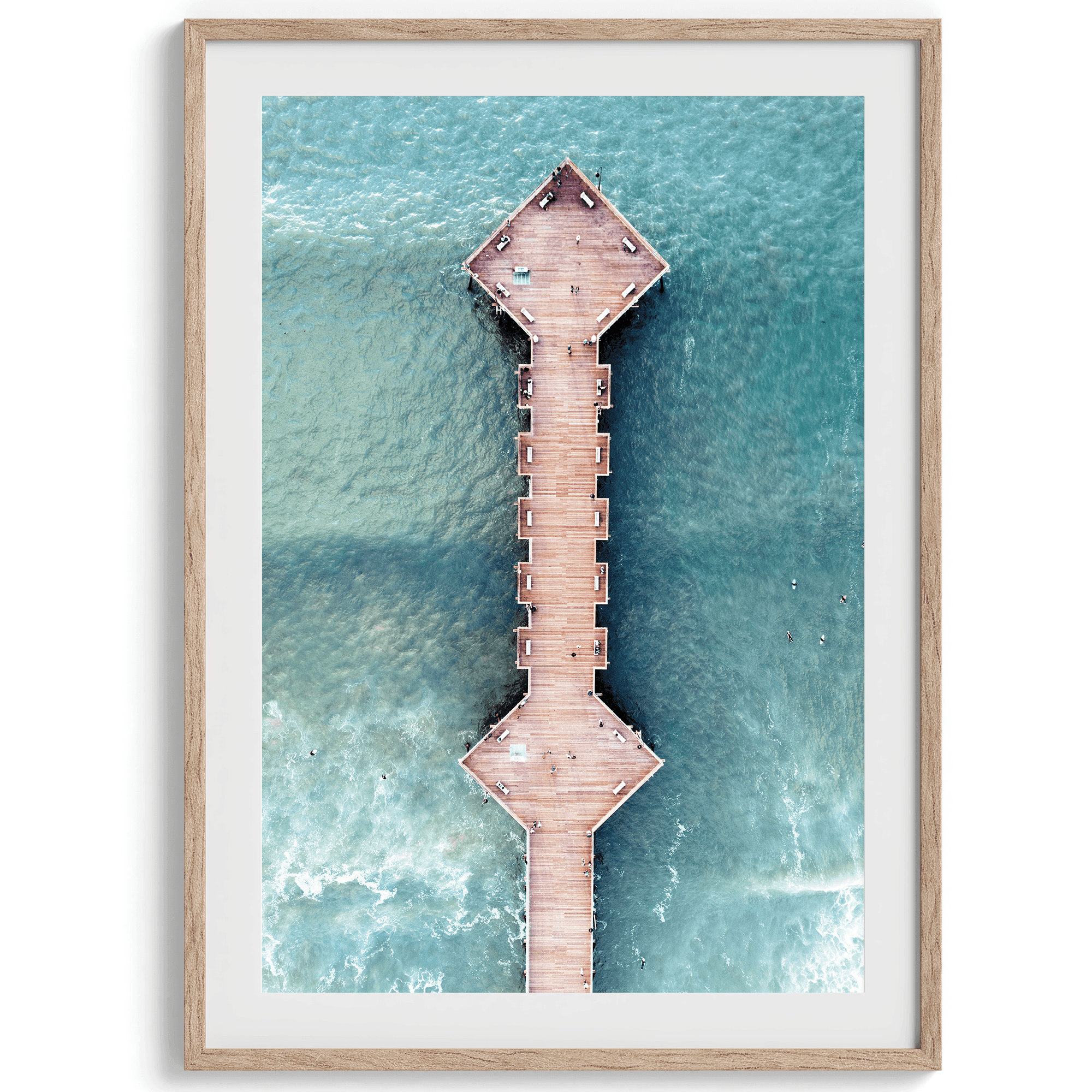 A fine art aerial beach pier photography pier. This ocean drone photography print was taken in Pismo Beach, California 300 feet above the ground. The result is minimalist geometrical wall art that brings out the beauty of the Pacific Ocean.