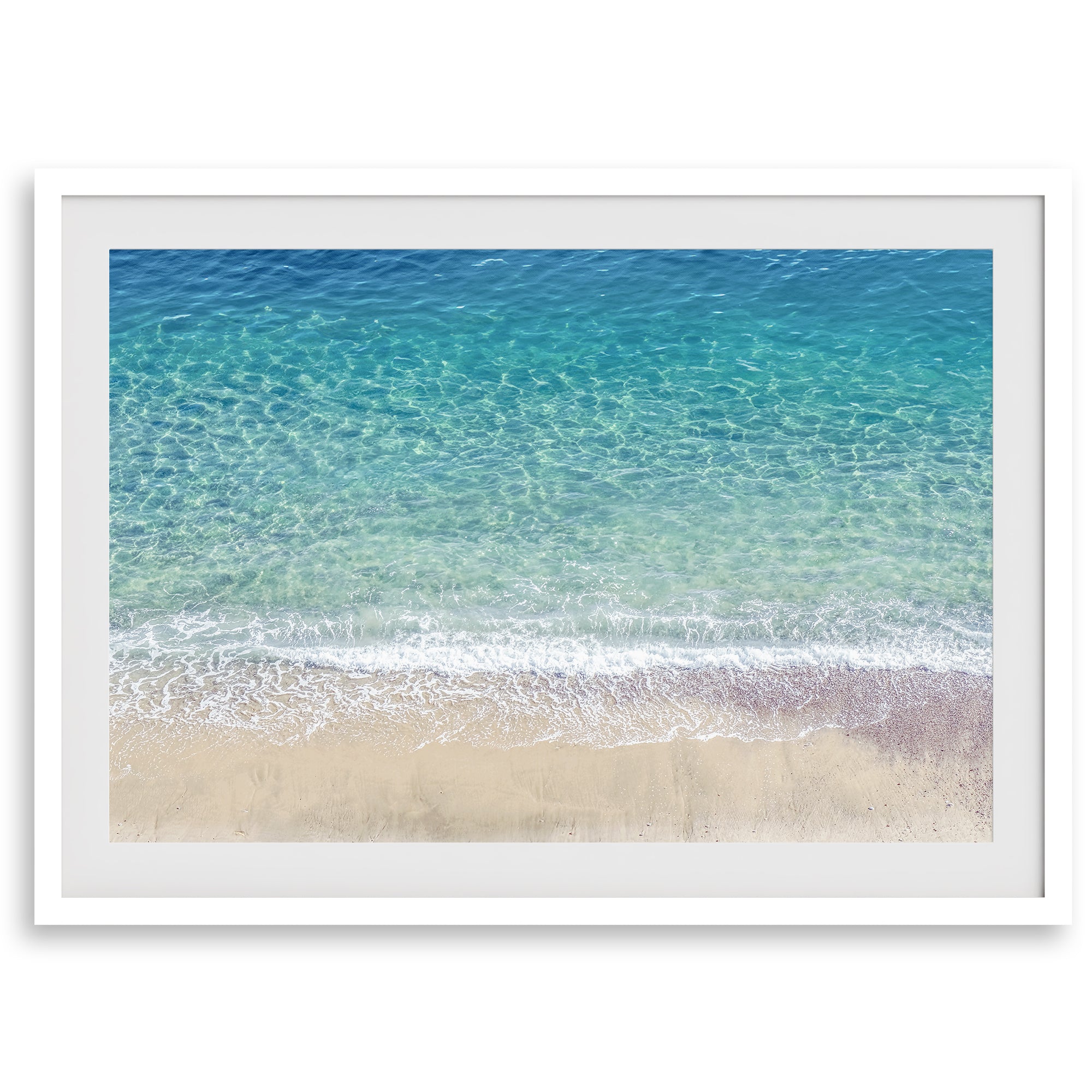 This fine art aerial beach print showcases the mesmerizing colors of the ocean in vivid detail. From the deep blue depths to the vibrant greenish turquoise blue, transitioning to the golden sandy beach and the crashing white surf.