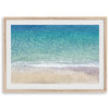 This fine art aerial beach print showcases the mesmerizing colors of the ocean in vivid detail. From the deep blue depths to the vibrant greenish turquoise blue, transitioning to the golden sandy beach and the crashing white surf.