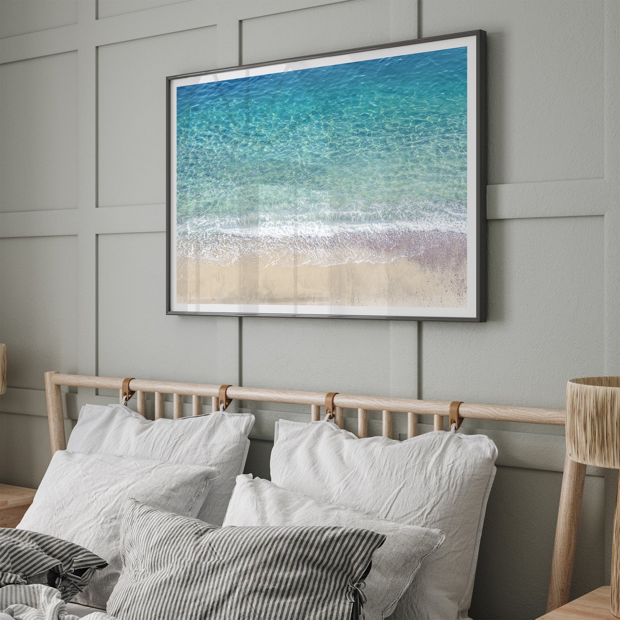 This fine art aerial beach print showcases the mesmerizing colors of the ocean in vivid detail. From the deep blue depths to the vibrant greenish turquoise blue, transitioning to the golden sandy beach and the crashing white surf.