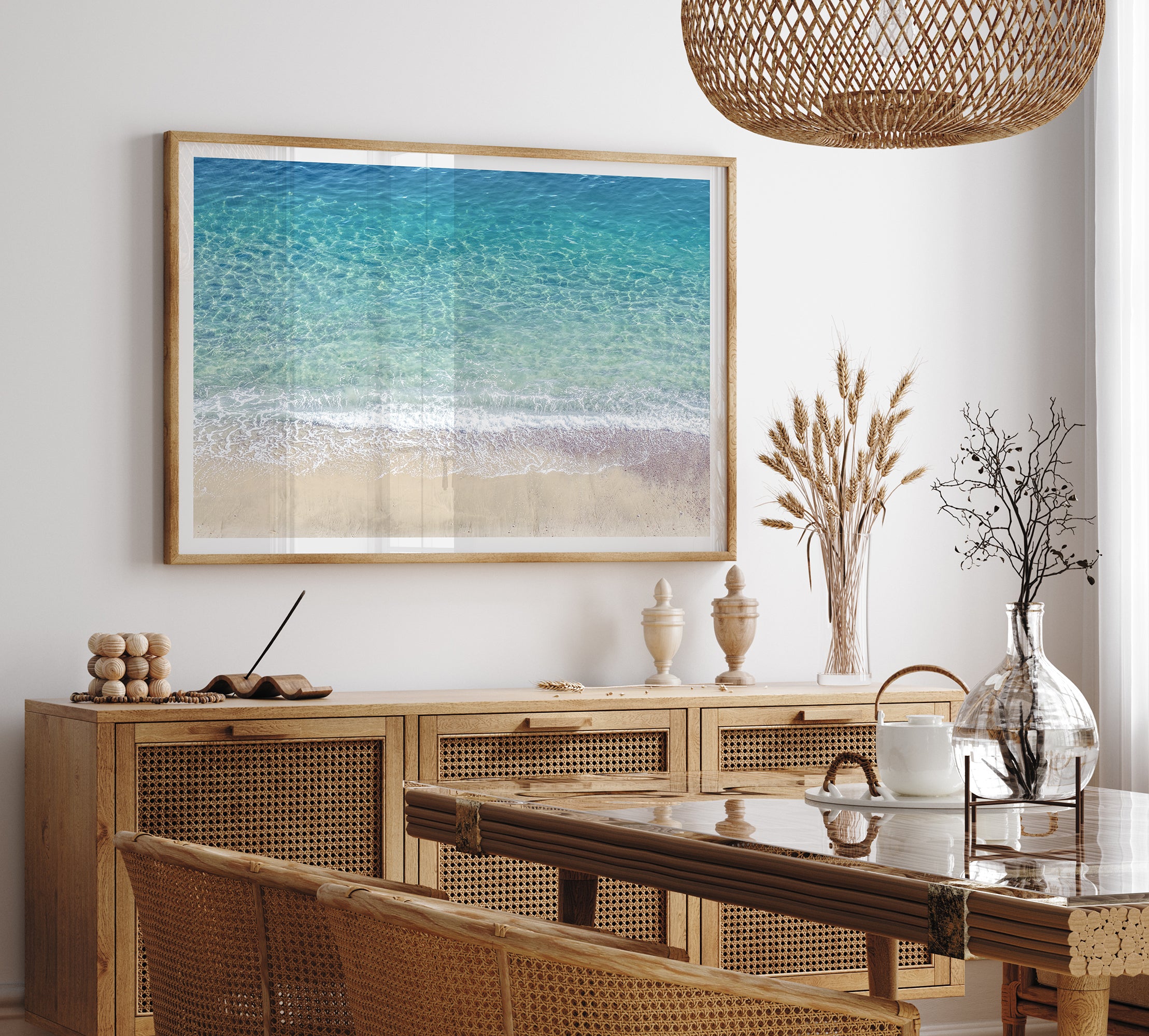 This fine art aerial beach print showcases the mesmerizing colors of the ocean in vivid detail. From the deep blue depths to the vibrant greenish turquoise blue, transitioning to the golden sandy beach and the crashing white surf.