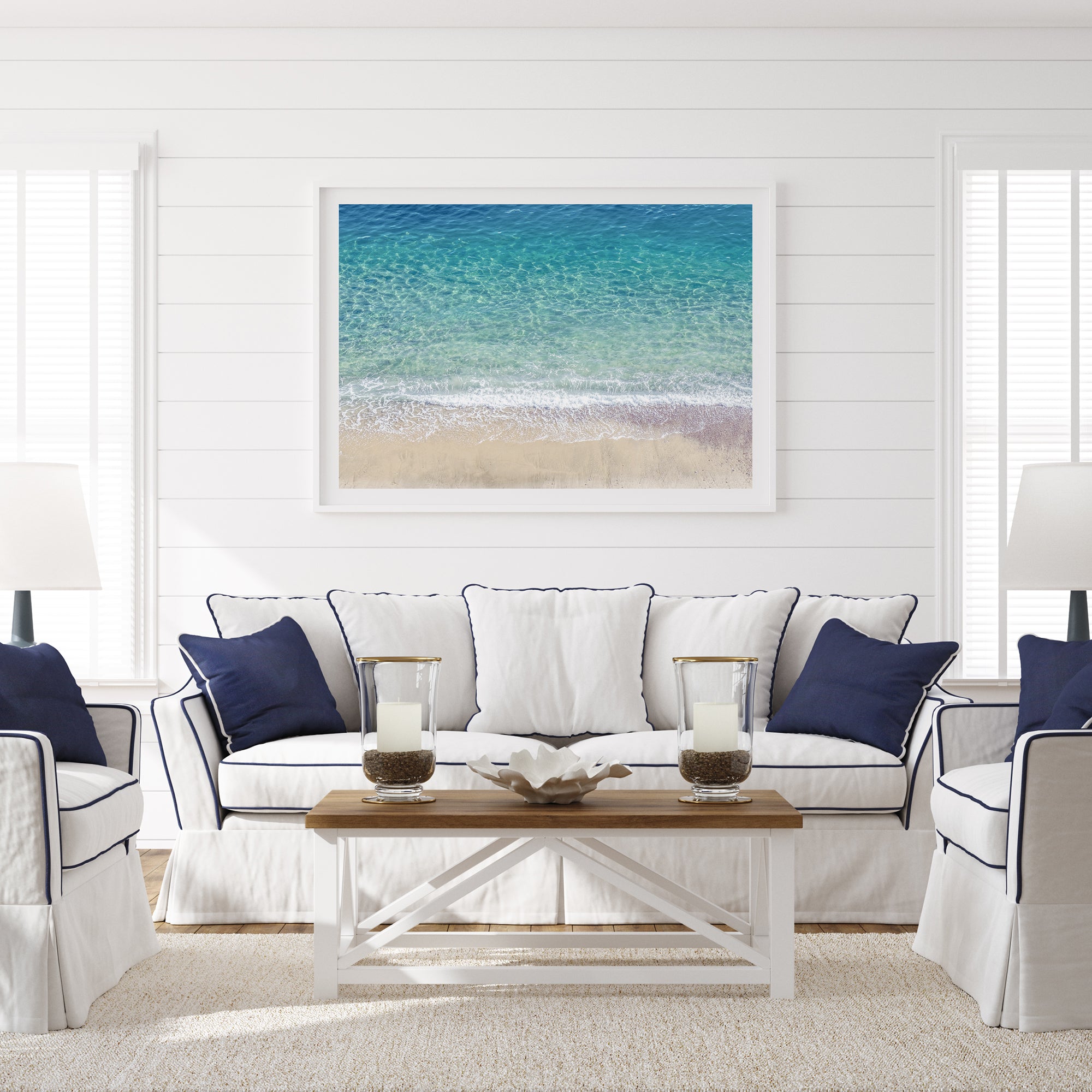 This fine art aerial beach print showcases the mesmerizing colors of the ocean in vivid detail. From the deep blue depths to the vibrant greenish turquoise blue, transitioning to the golden sandy beach and the crashing white surf.