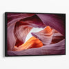 Vivid Antelope Canyon canvas featuring glowing sandstone curves in warm orange, red, and purple hues with sunlight streaming through.