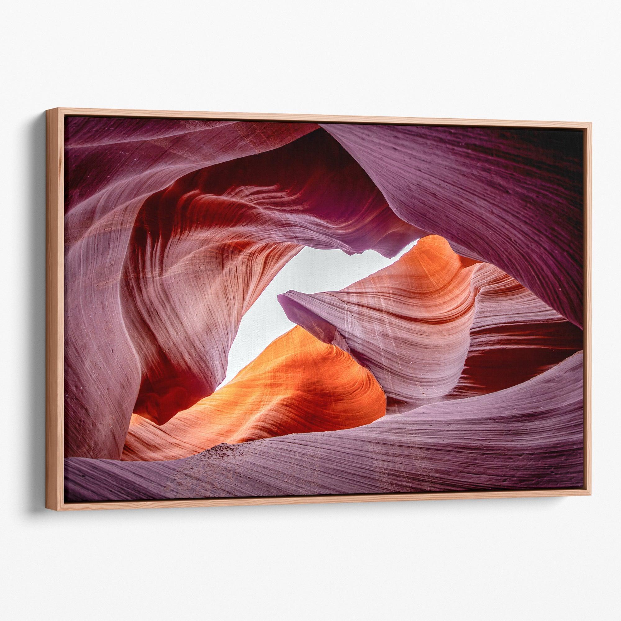 Vivid Antelope Canyon canvas featuring glowing sandstone curves in warm orange, red, and purple hues with sunlight streaming through.