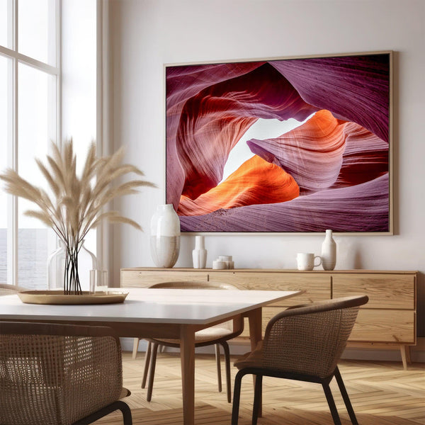 Vivid Antelope Canyon canvas featuring glowing sandstone curves in warm orange, red, and purple hues with sunlight streaming through.