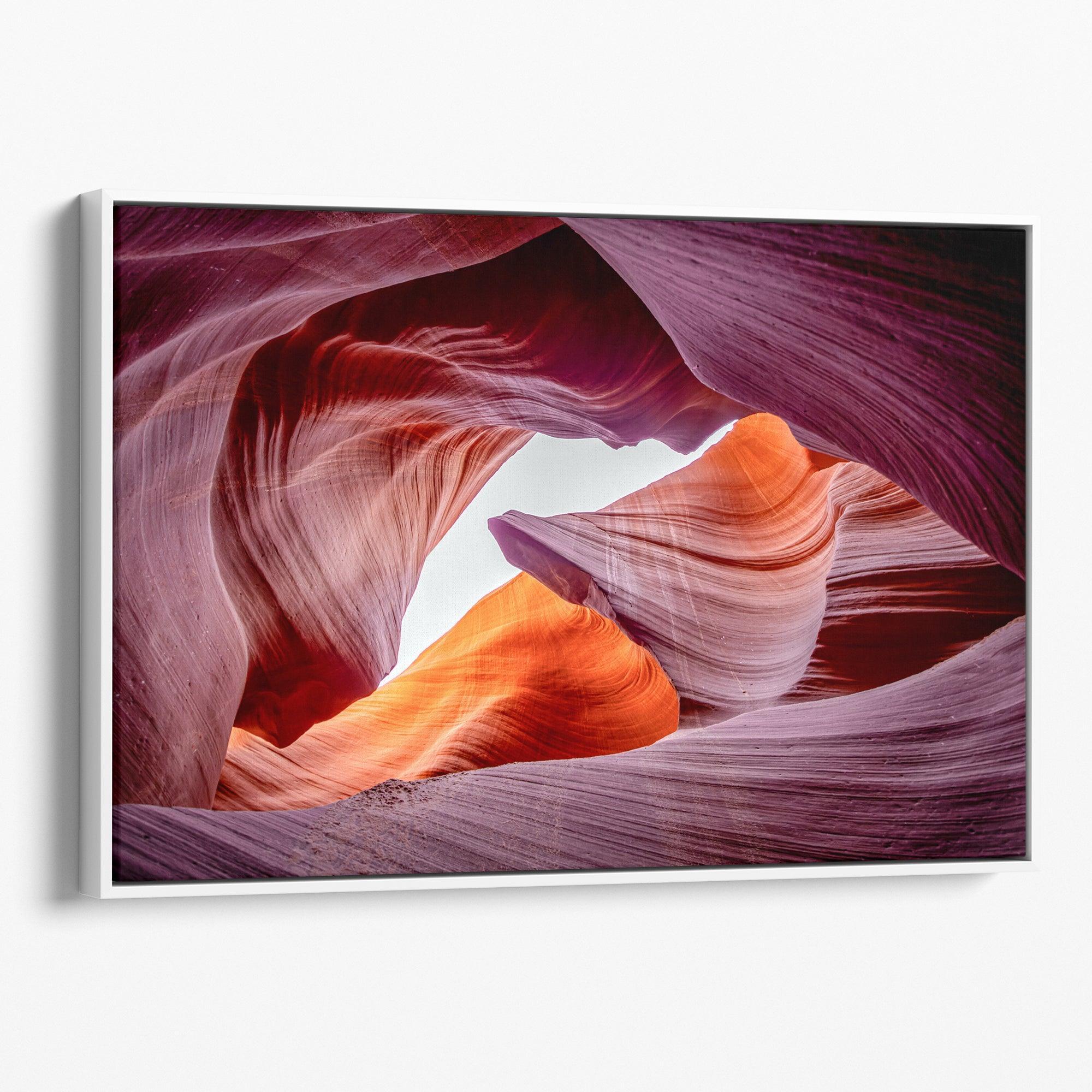 Vivid Antelope Canyon canvas featuring glowing sandstone curves in warm orange, red, and purple hues with sunlight streaming through.