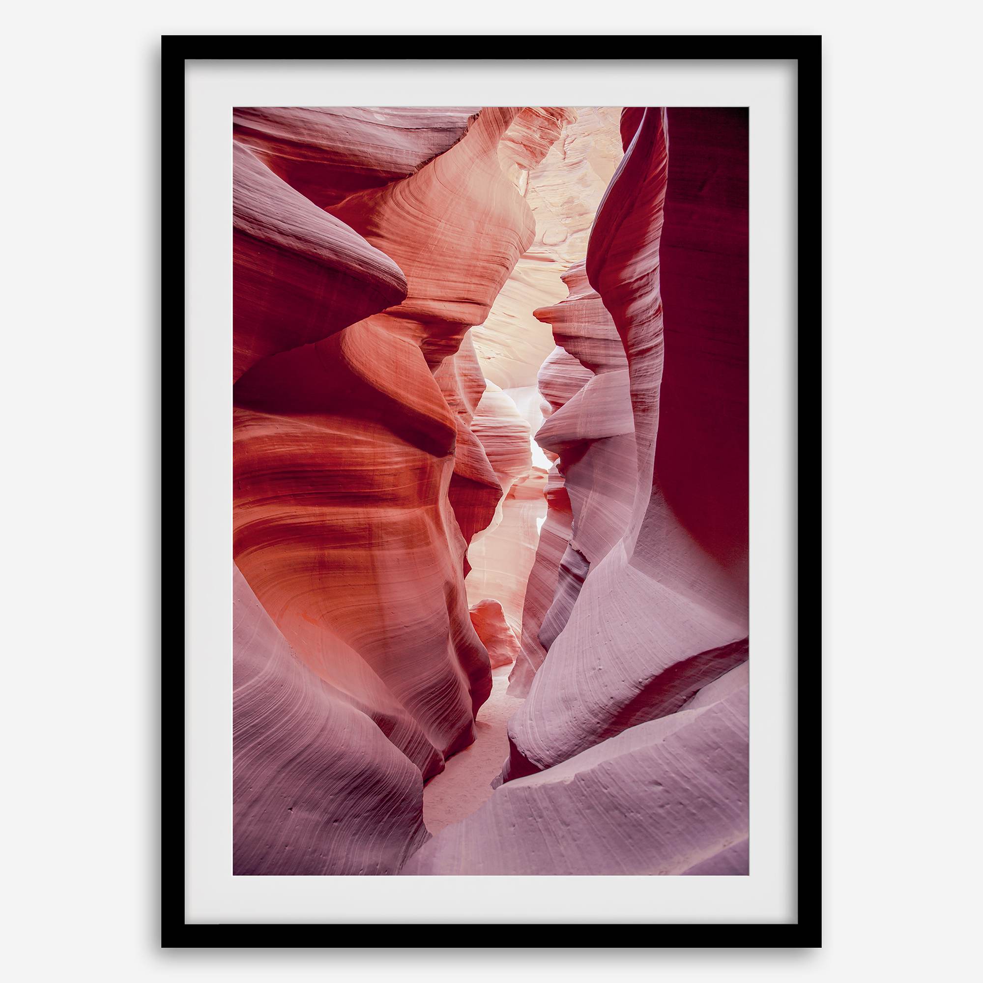 This beautiful Arizona desert wall art captures the mesmerizing beauty of Antelope Canyon. The picture showcases a passage through the rock in the canyon, with vibrant pink and purple textures that create a sense of depth and dimension.