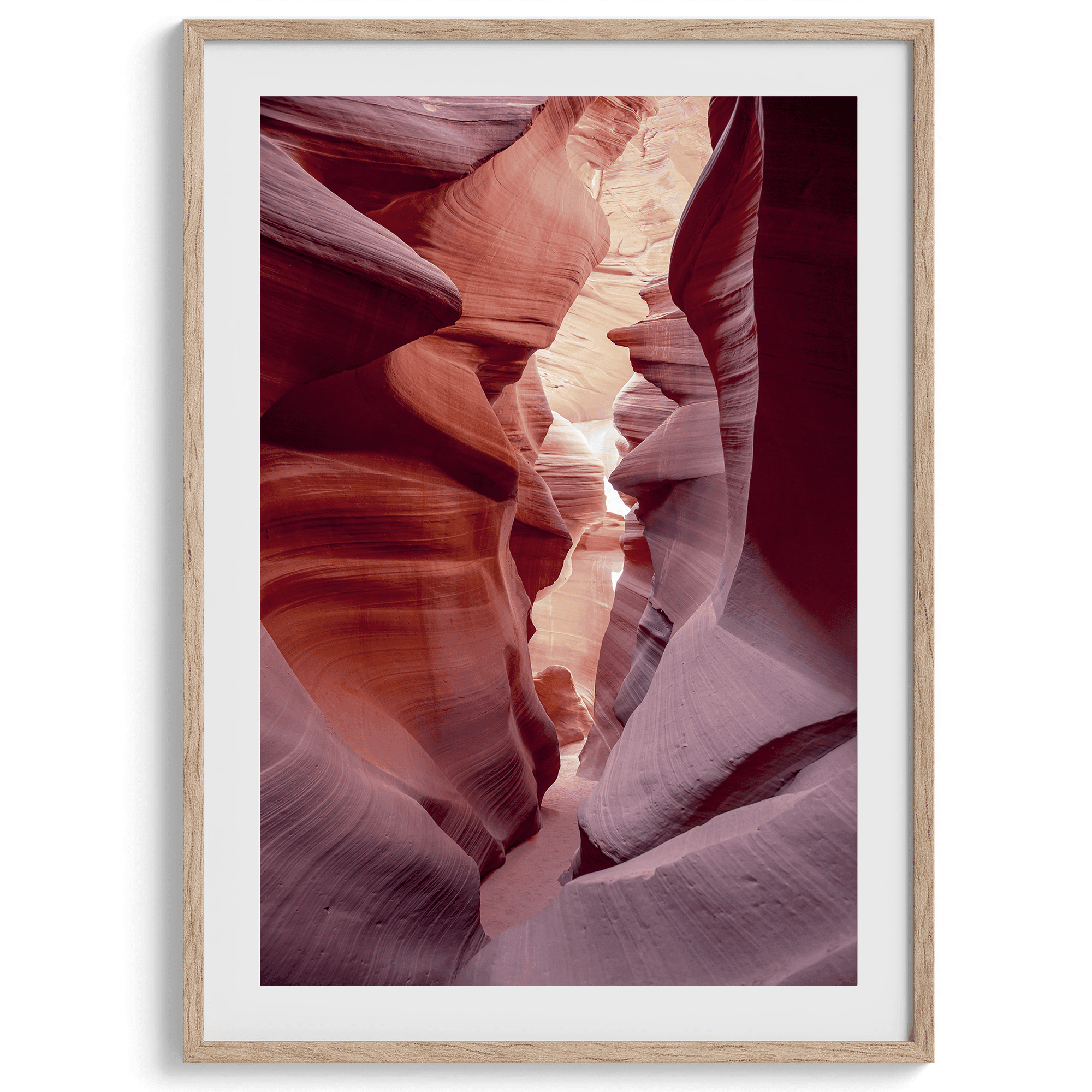 This beautiful Arizona desert wall art captures the mesmerizing beauty of Antelope Canyon. The picture showcases a passage through the rock in the canyon, with vibrant pink and purple textures that create a sense of depth and dimension.