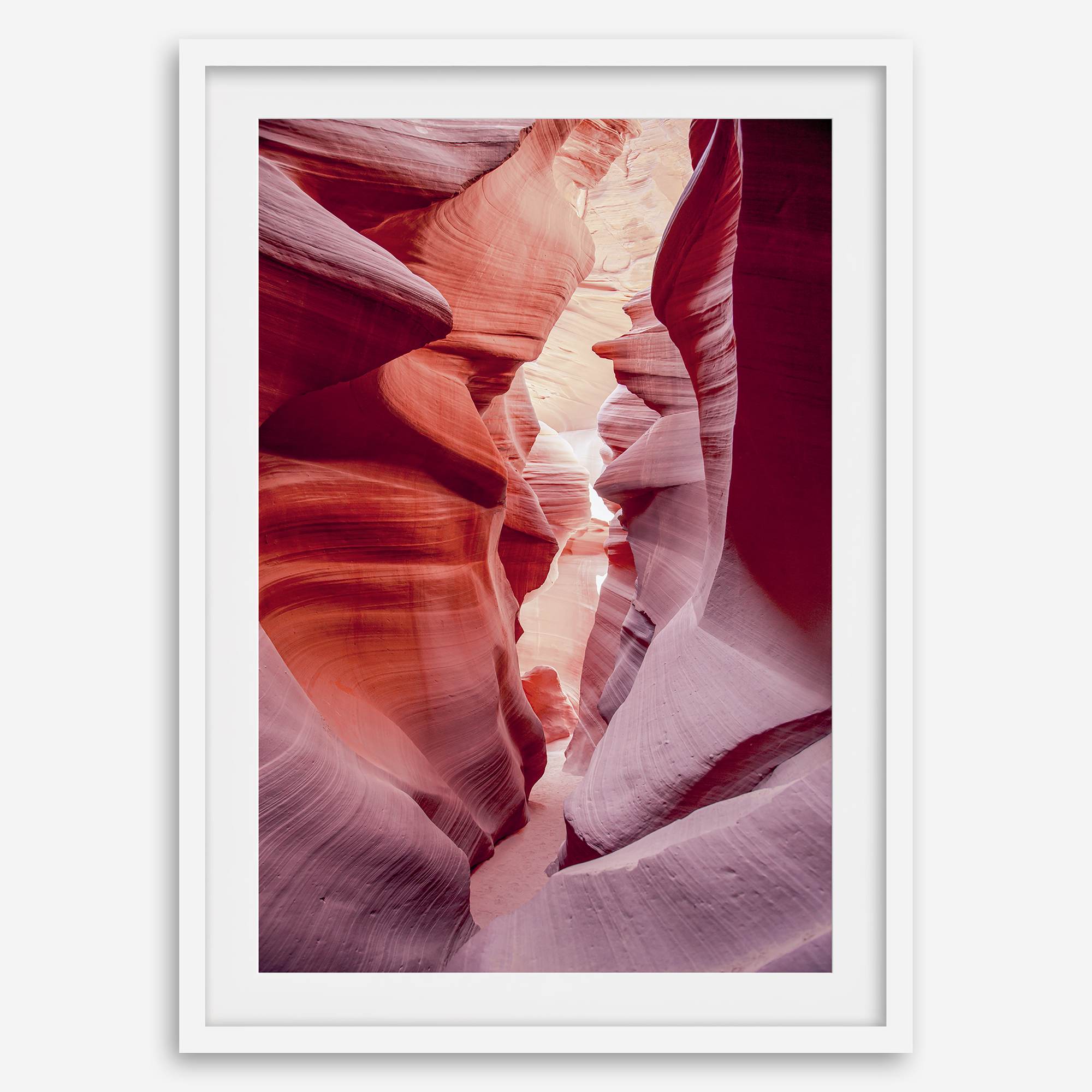 This beautiful Arizona desert wall art captures the mesmerizing beauty of Antelope Canyon. The picture showcases a passage through the rock in the canyon, with vibrant pink and purple textures that create a sense of depth and dimension.