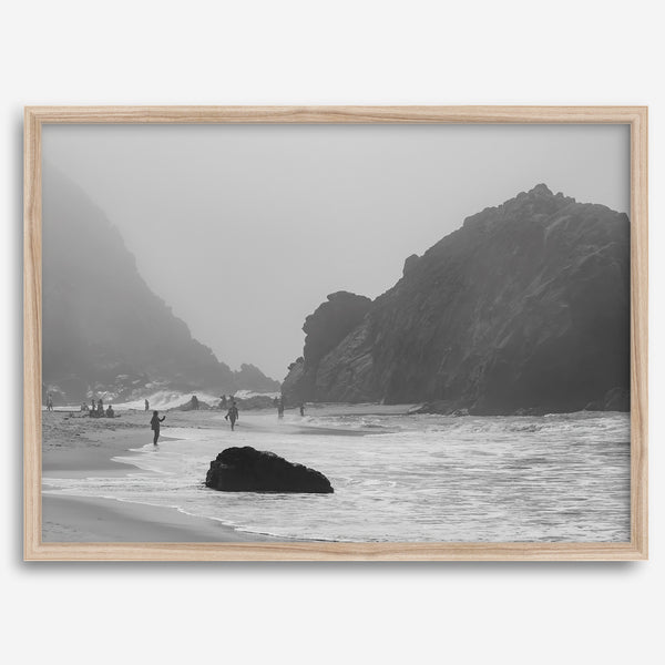 A framed black and white print of the beautiful Pfeiffer Beach in Big Sur hung in the living room. This wall art showcases the dramatic rocks and mist of the Big Sur coastline and the day-to-day life of the beach.