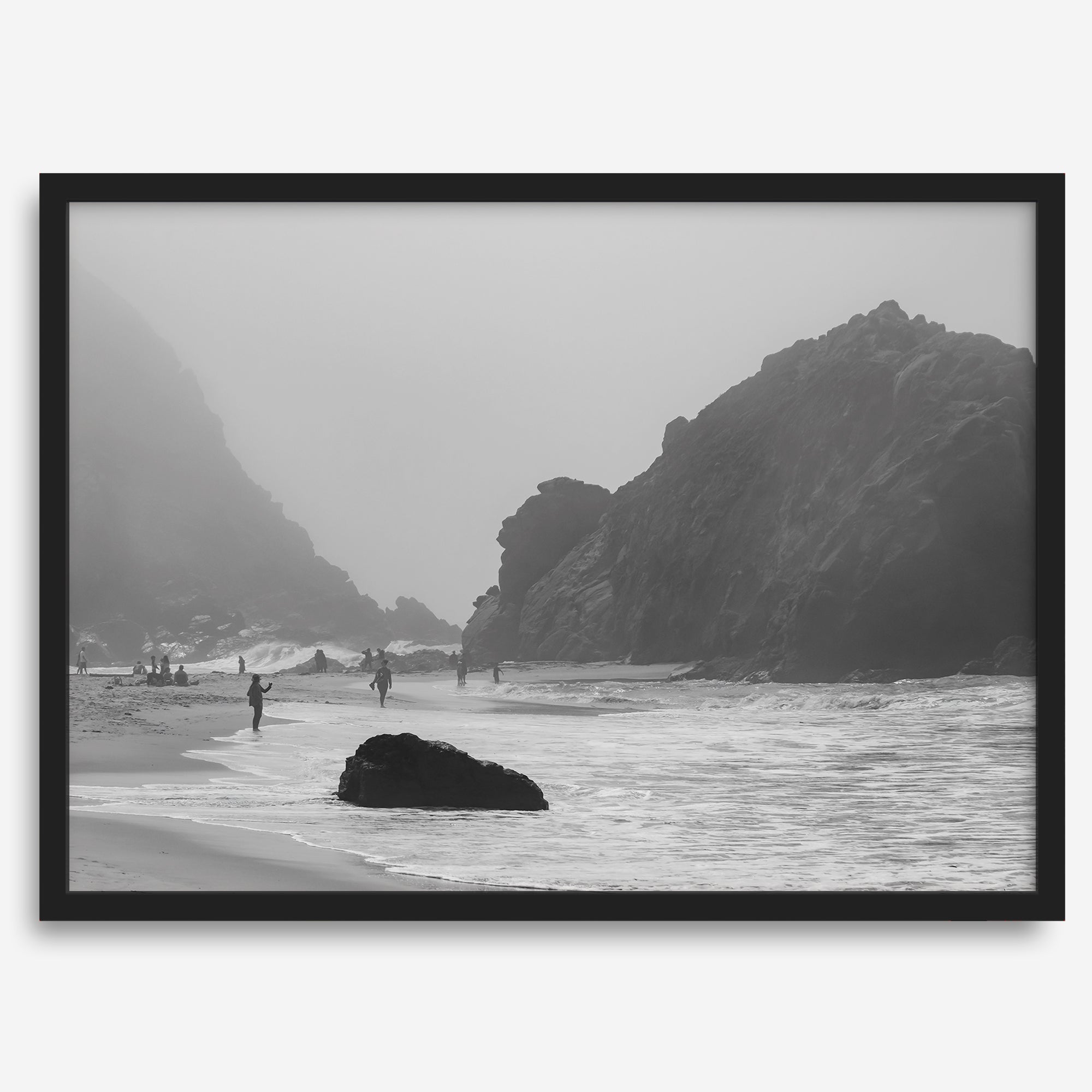 A framed black and white print of the beautiful Pfeiffer Beach in Big Sur hung in the living room. This wall art showcases the dramatic rocks and mist of the Big Sur coastline and the day-to-day life of the beach.