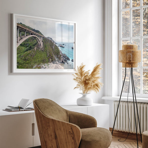 A fine art ocean print of one of the most iconic spots in the famous Route 1 in California - Bixby Bridge near Big Sur. Shot in a unique wide angle that captures the bridge, cliffs, the ocean, and the stunning beach below.