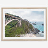 A fine art ocean print of one of the most iconic spots in the famous Route 1 in California - Bixby Bridge near Big Sur. Shot in a unique wide angle that captures the bridge, cliffs, the ocean, and the stunning beach below.
