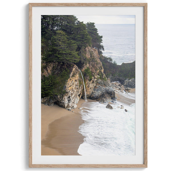 Unique coastal wall art of McWay Beach in Big Sur with a waterfall flowing onto the sandy beach.