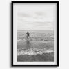 A black and white fine art lake beach print of a beach in Chicago on the coast of Lake Michigan showcasing a woman bathing in the lake. The classic modern look of the print is sure to impress when hung on your walls.