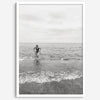 A black and white fine art lake beach print of a beach in Chicago on the coast of Lake Michigan showcasing a woman bathing in the lake. The classic modern look of the print is sure to impress when hung on your walls.