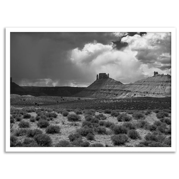 Black and white Utah wall art featuring dramatic desert rock formations and storm clouds