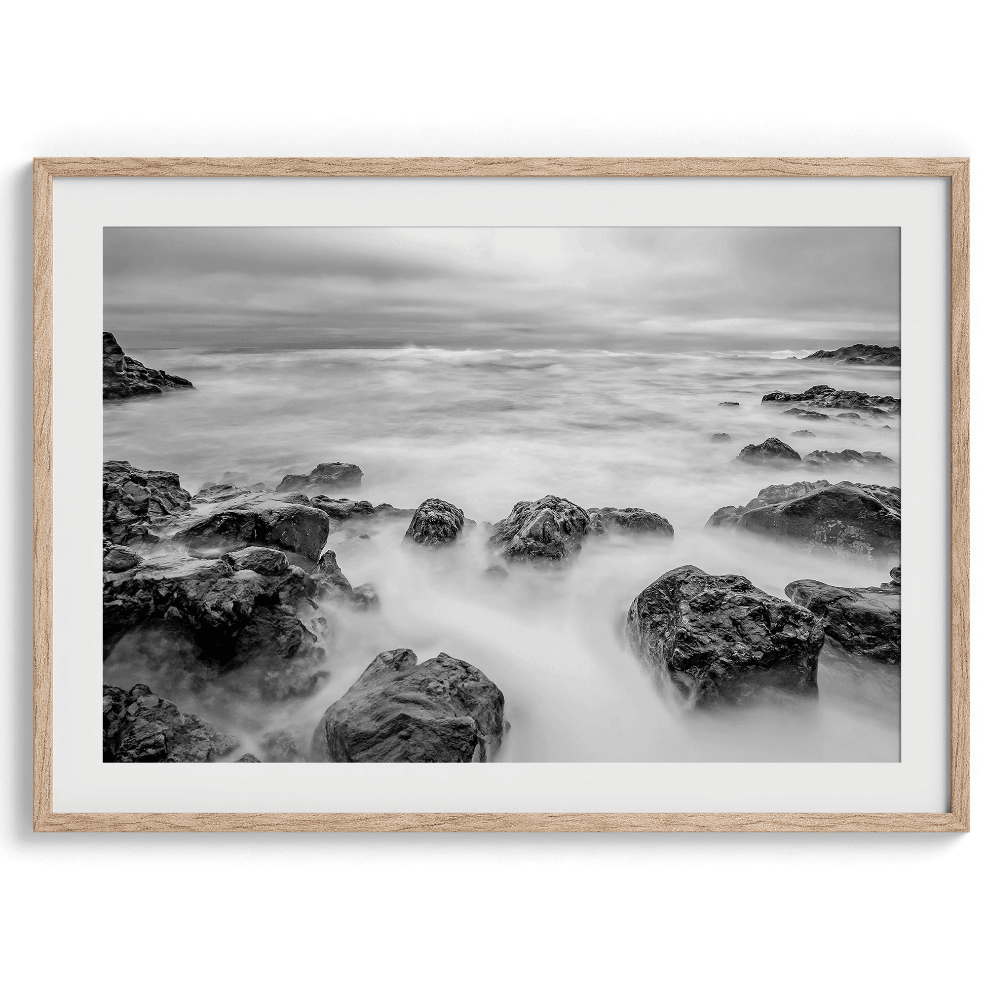 Stunning moody black and white beach fine art print from Pescadero, California. The Pacific Ocean looks creamy in this fine art long-exposure photography print.