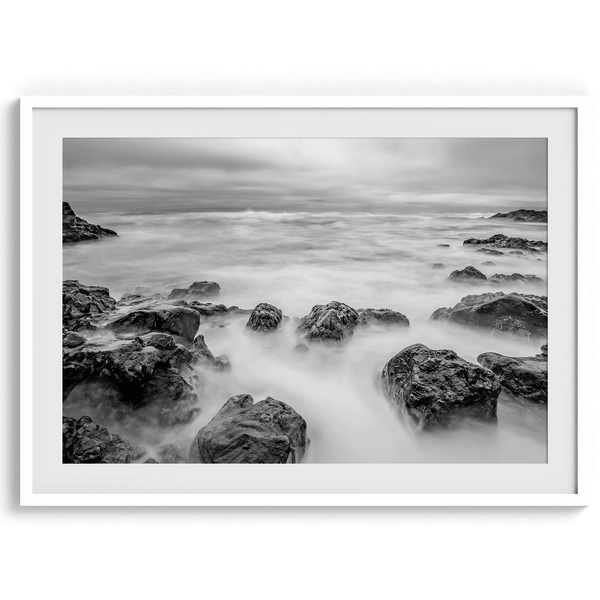 Stunning moody black and white beach fine art print from Pescadero, California. The Pacific Ocean looks creamy in this fine art long-exposure photography print.