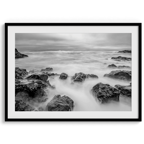 Stunning moody black and white beach fine art print from Pescadero, California. The Pacific Ocean looks creamy in this fine art long-exposure photography print.