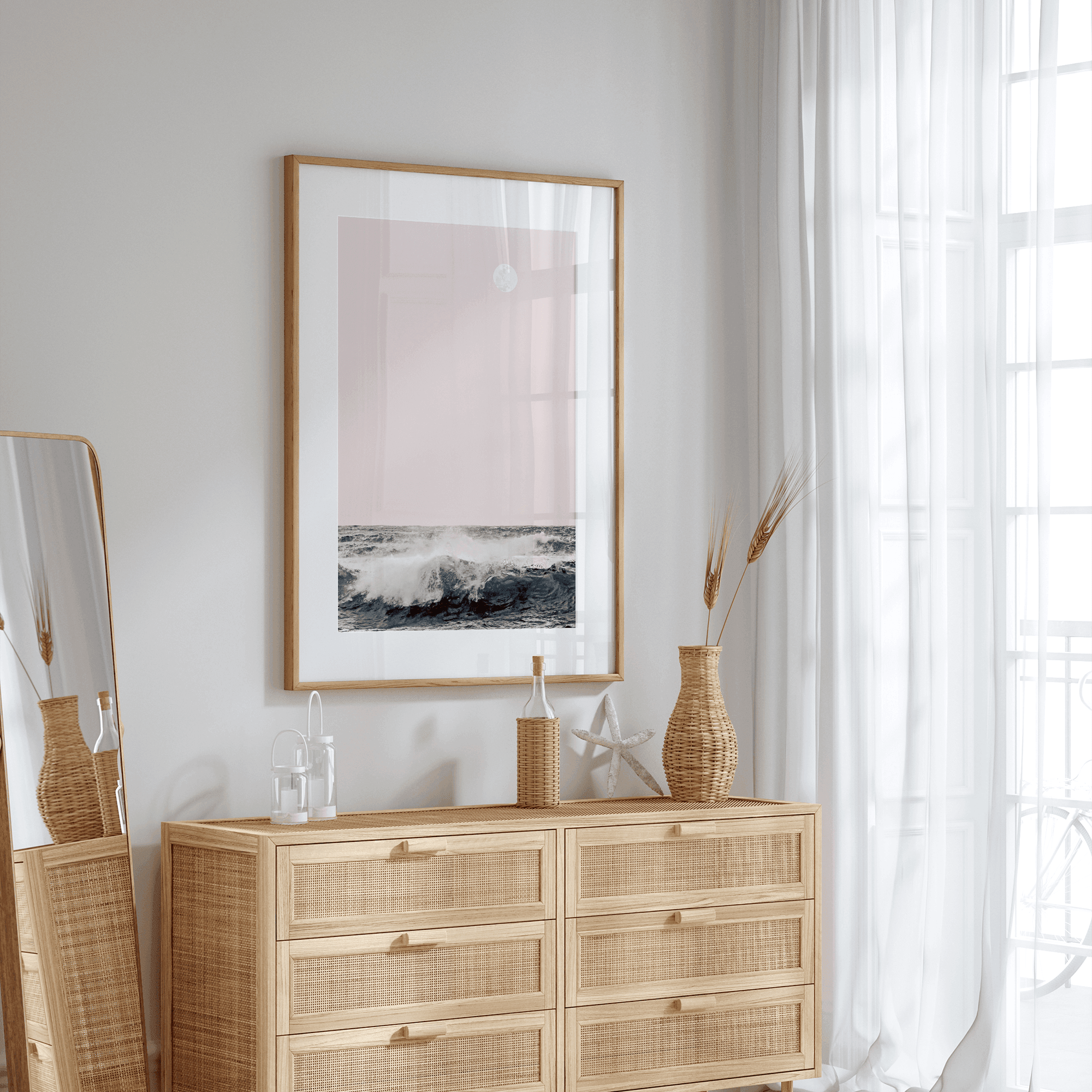 This extraordinary ocean wall art captures a mesmerizing moment when a powerful wave crashes while the sunset gentle blush pink hues fill the sky and a large full moon rises majestically in the backdrop.