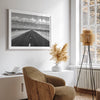 This stunning piece of black and white desert wall art will take your breath away. A beautifully framed picture of a Death Valley National Park road leading towards the snow-covered mountains at the end of the desert.