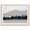 Abstract nature art of a forested island on Yellowstone Lake with black-and-white photography and misty mountains.