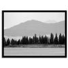 Abstract nature art of a forested island on Yellowstone Lake with black-and-white photography and misty mountains.