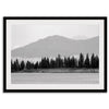 Abstract nature art of a forested island on Yellowstone Lake with black-and-white photography and misty mountains.