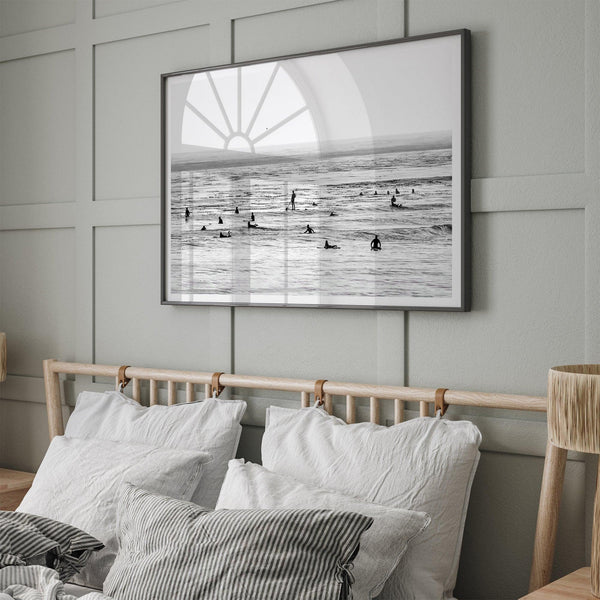 Black and white surf prints showing surfers in calm ocean waters, perfect for beach house wall art or minimalist coastal decor.