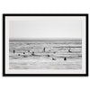 Black and white surf prints showing surfers in calm ocean waters, perfect for beach house wall art or minimalist coastal decor.