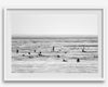 Black and white surf prints showing surfers in calm ocean waters, perfect for beach house wall art or minimalist coastal decor.