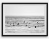 Black and white surf prints showing surfers in calm ocean waters, perfect for beach house wall art or minimalist coastal decor.