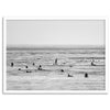 Black and white surf prints showing surfers in calm ocean waters, perfect for beach house wall art or minimalist coastal decor.