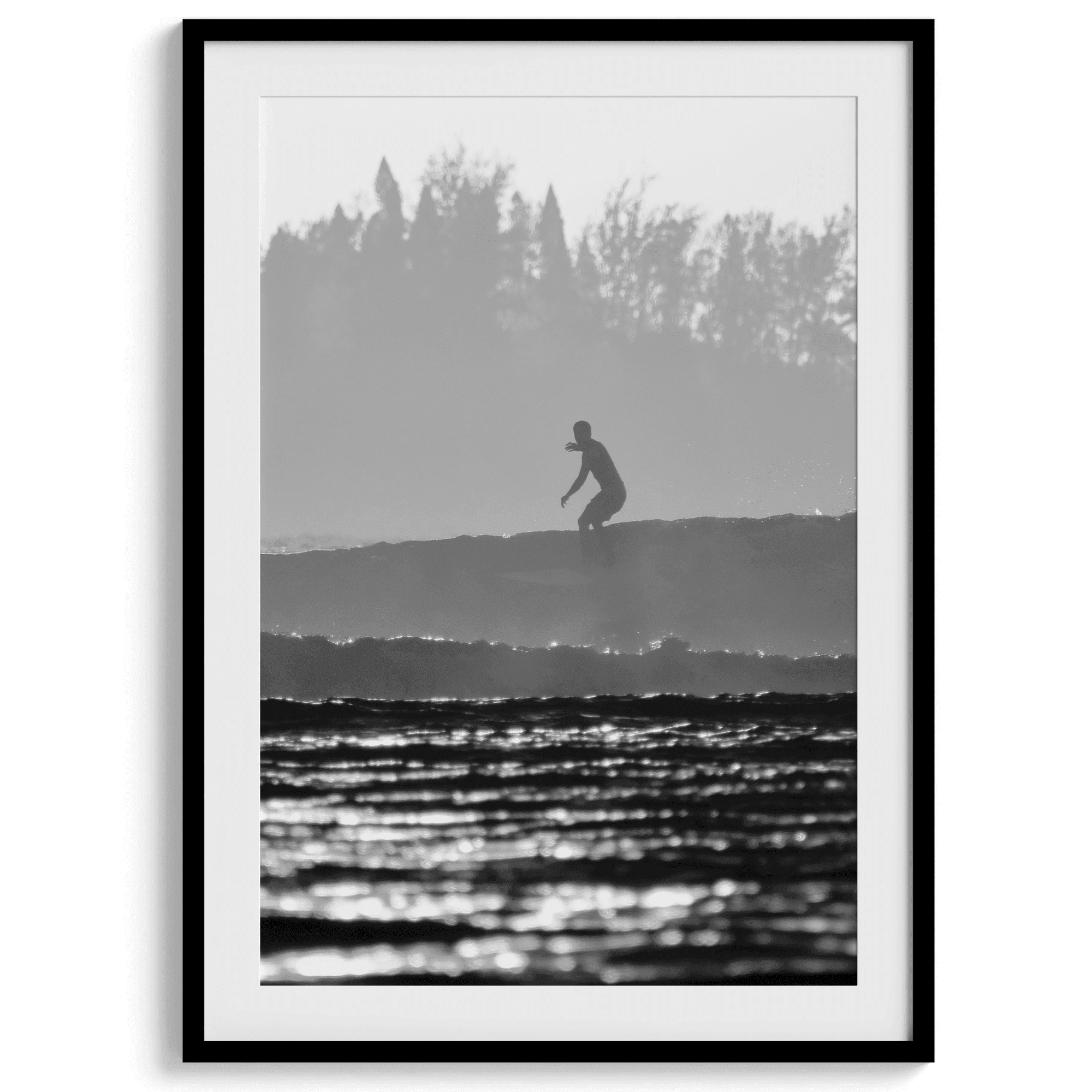 Black and white vertical photo print of a surfer riding a wave in Kauai, Hawaii.