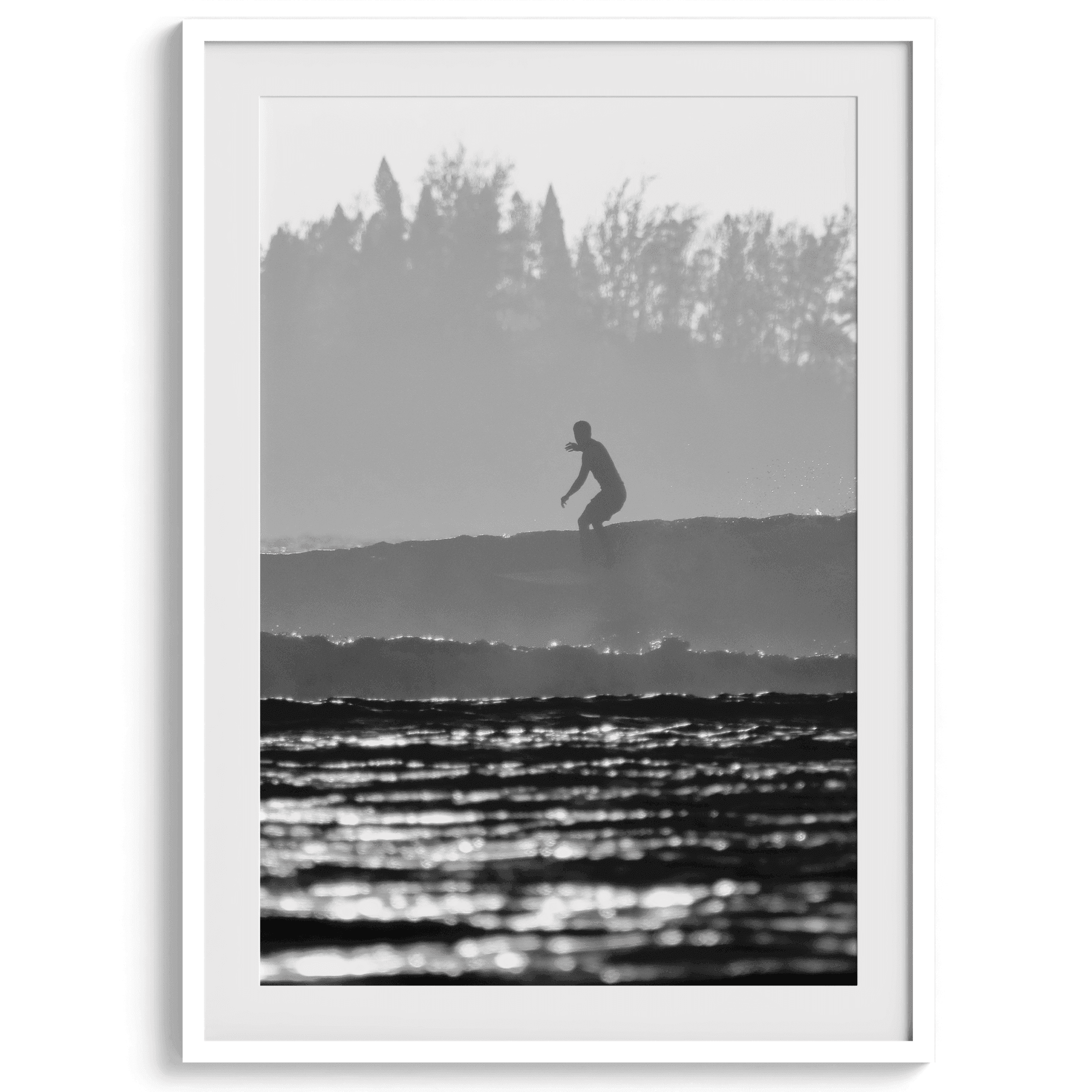 Black and white vertical photo print of a surfer riding a wave in Kauai, Hawaii.