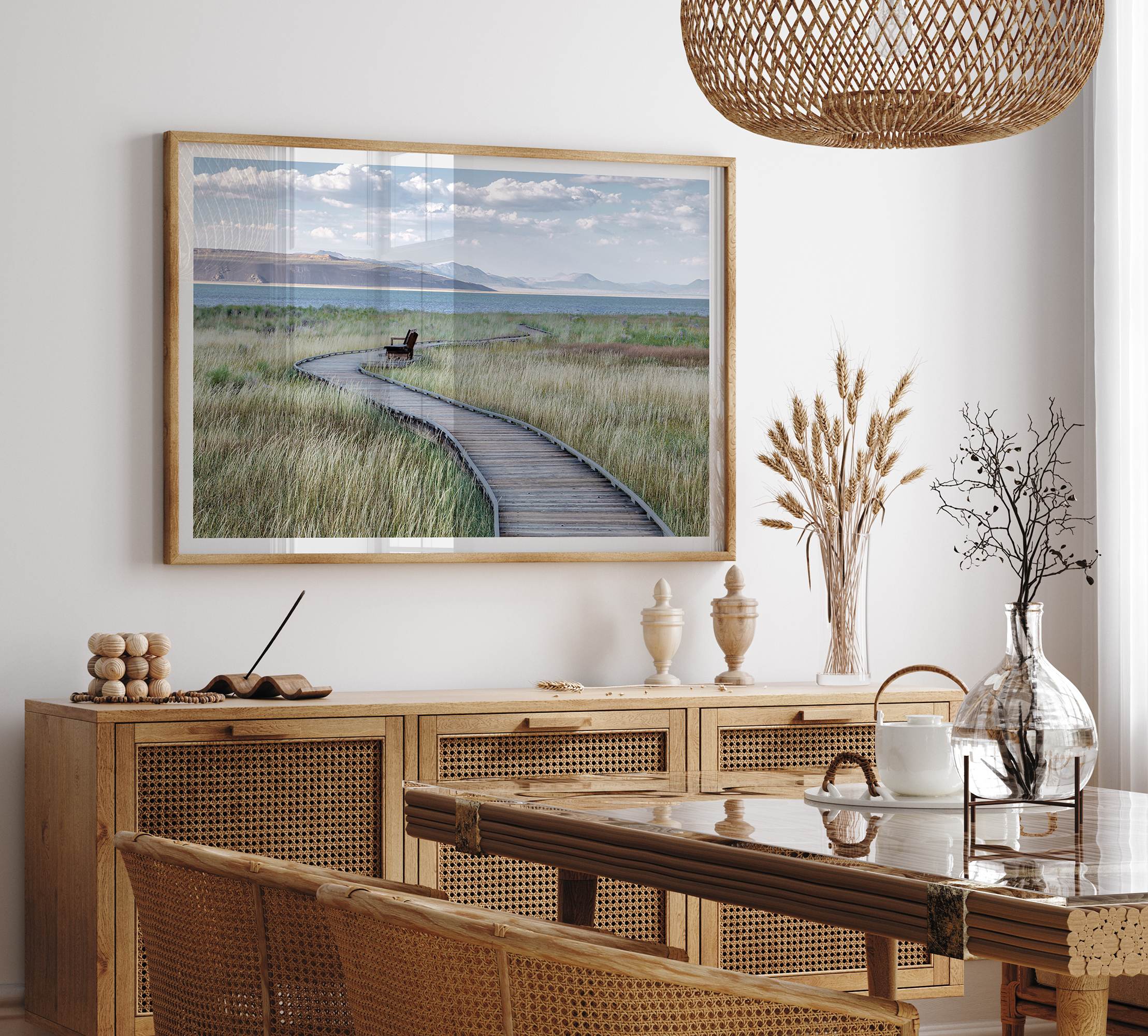 Framed Mono Lake nature photography print featuring a winding boardwalk through tall grasses, leading to a quiet bench beside the lake with mountains in the background.