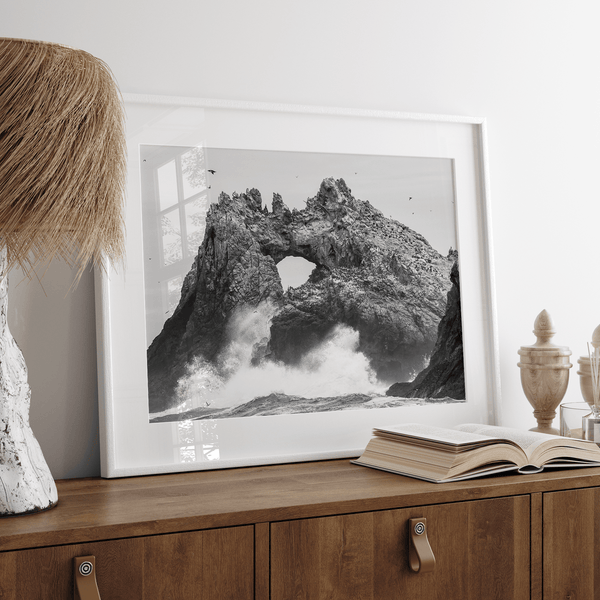 A fine art dramatic moody beach print featuring the stunning Farallon Islands near San Francisco with waves crashing against the rocks and hundreds of birds flying around.