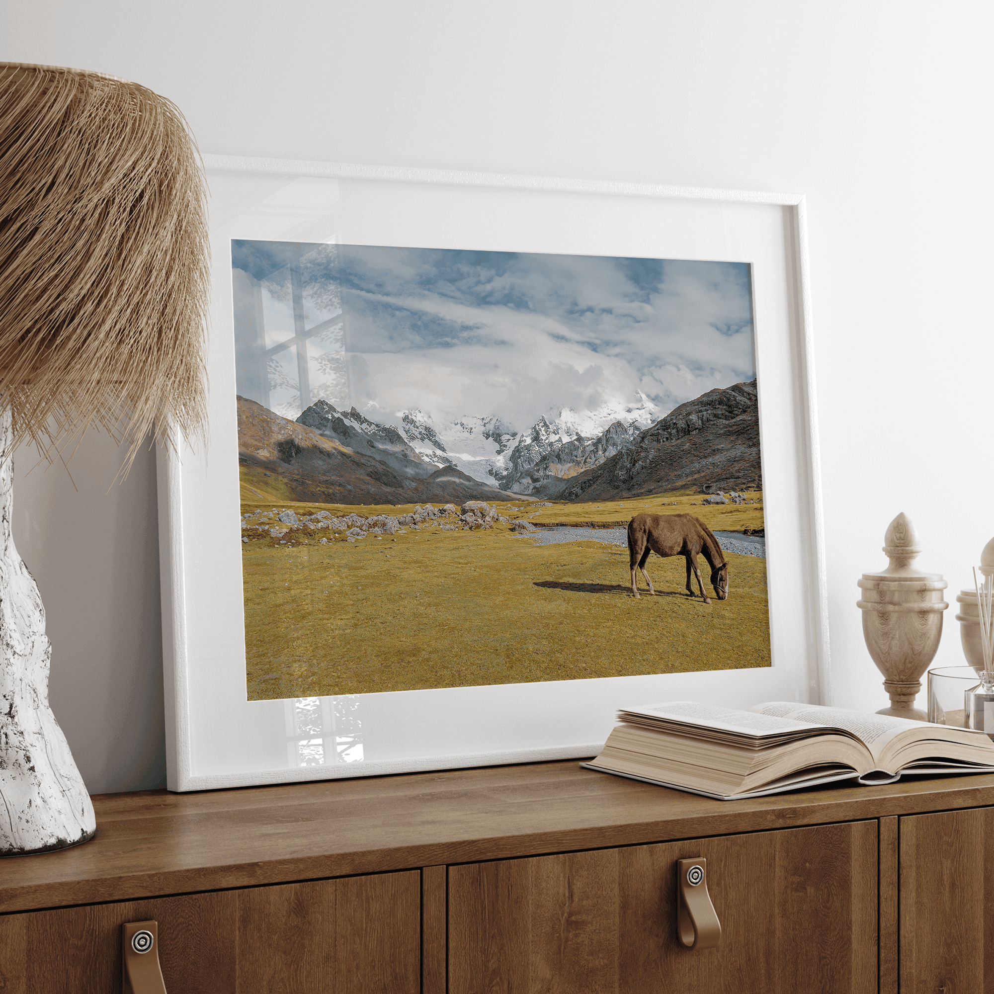 This stunning piece of mountain Horse wall art was taken in Peru and showcases beautiful snow-covered mountains and grassy meadows in Peru and a charming horse grazing relaxingly in the forefront of the picture.