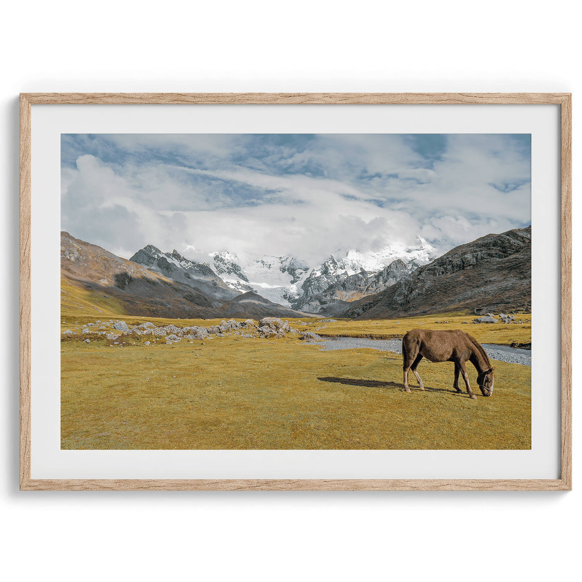 This stunning piece of mountain Horse wall art was taken in Peru and showcases beautiful snow-covered mountains and grassy meadows in Peru and a charming horse grazing relaxingly in the forefront of the picture.