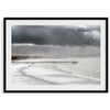 This fine art ocean photography print was taken in Pismo Beach, California, and showcases a distant view of an ocean pier and stormy clouds. Looking long and hard, you can see tens of surfers around the pier.